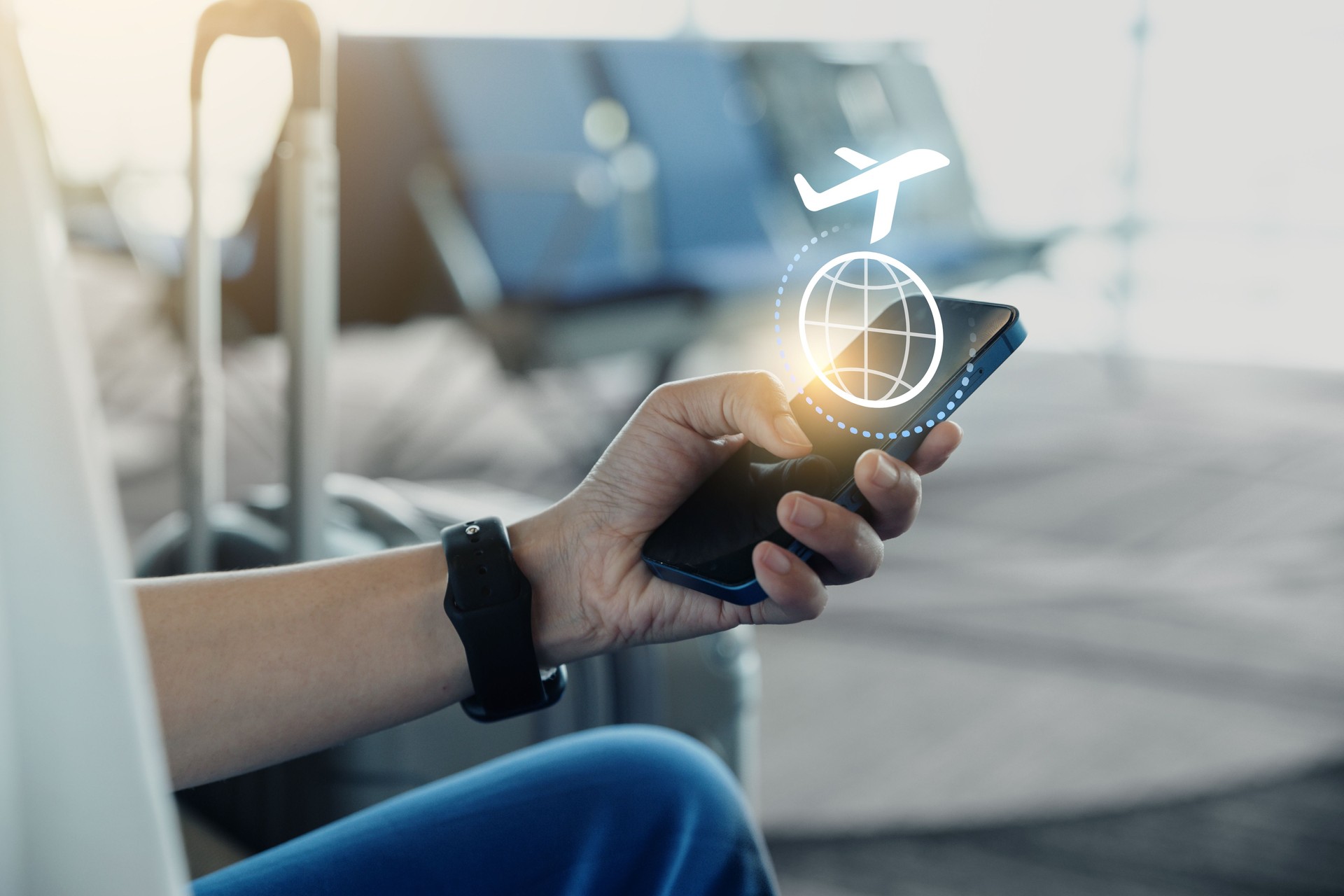Young man using phone with check travel time or in-flight insurance.